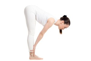 Stand with your feet hip-width apart and back straight. Bend your knees and tip at the hips until your fingertips are at your knees. As you breathe out, lead with thumbs and draw shoulders back and down.