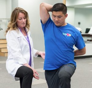 Doctor of Physical Therapy working with a patient